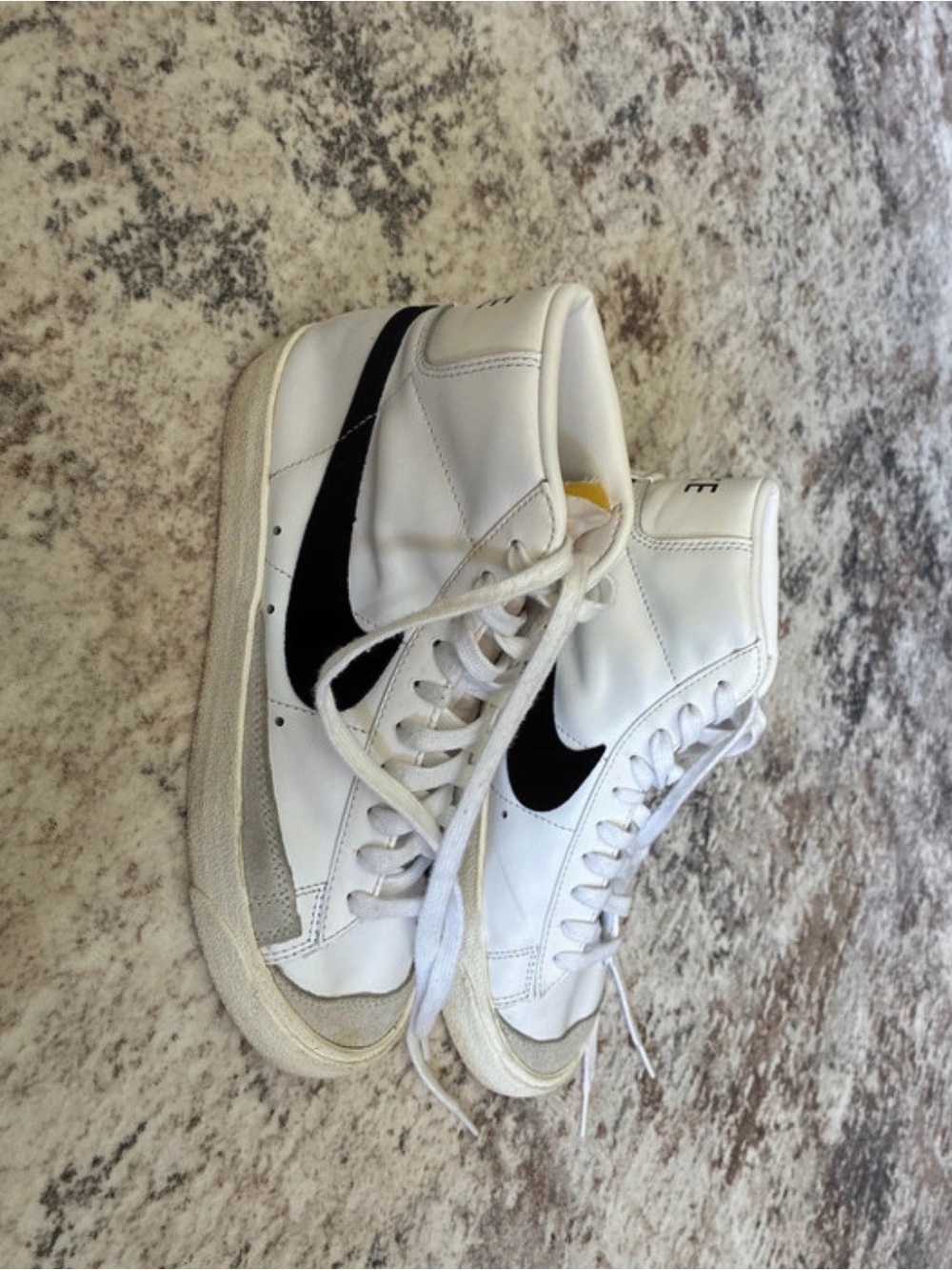 Nike White High-Top Sneakers with Black Swoosh